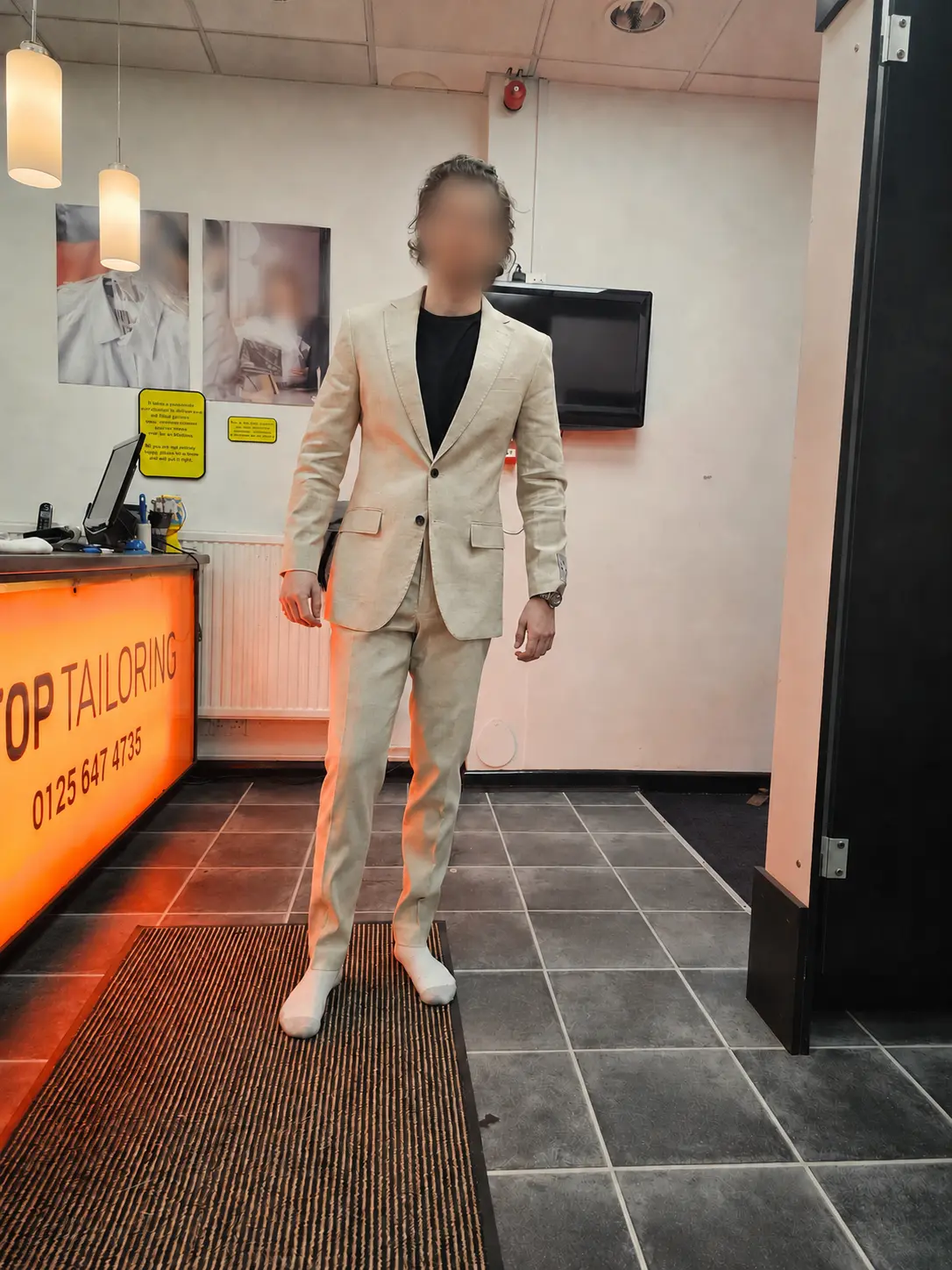 A light beige suit after precision alterations