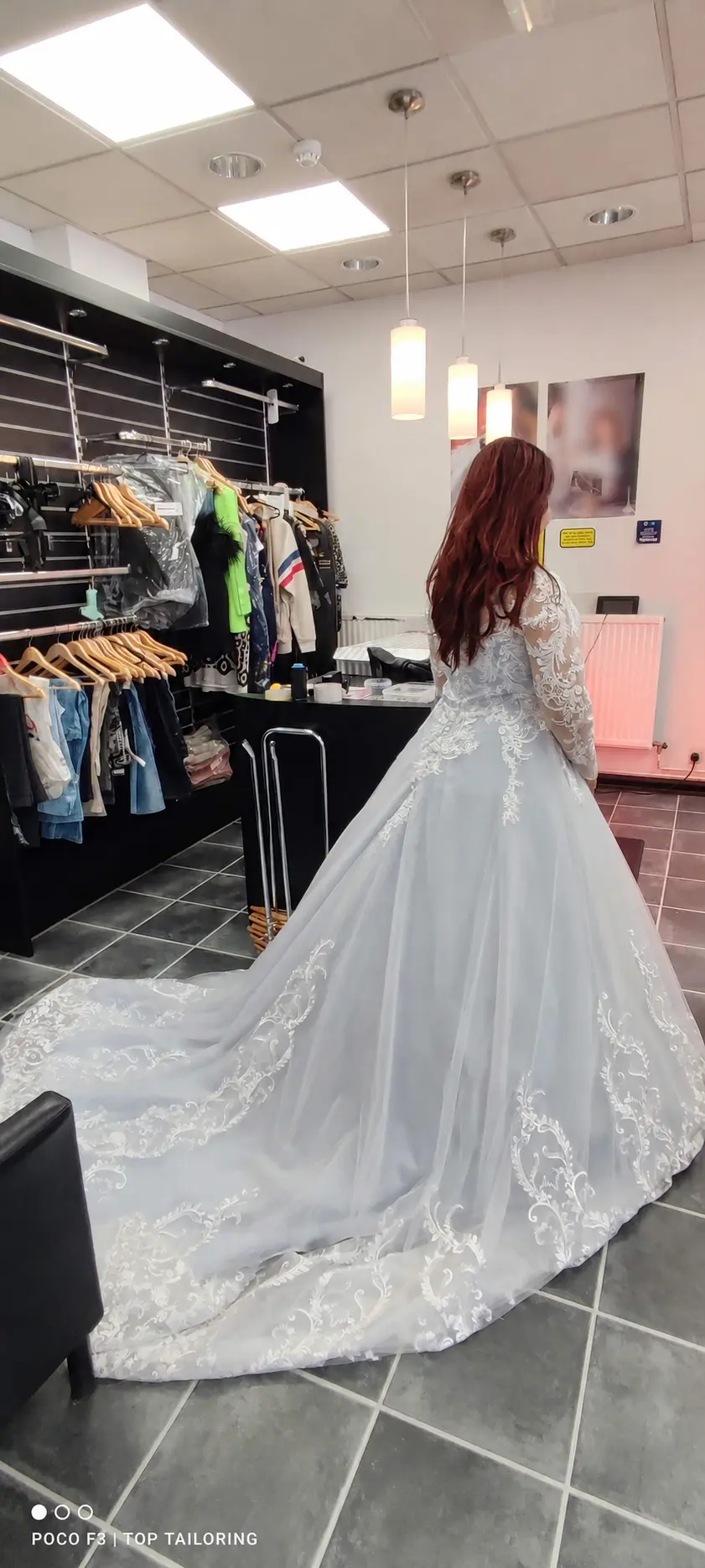A pale-blue bridal gown with a lace train