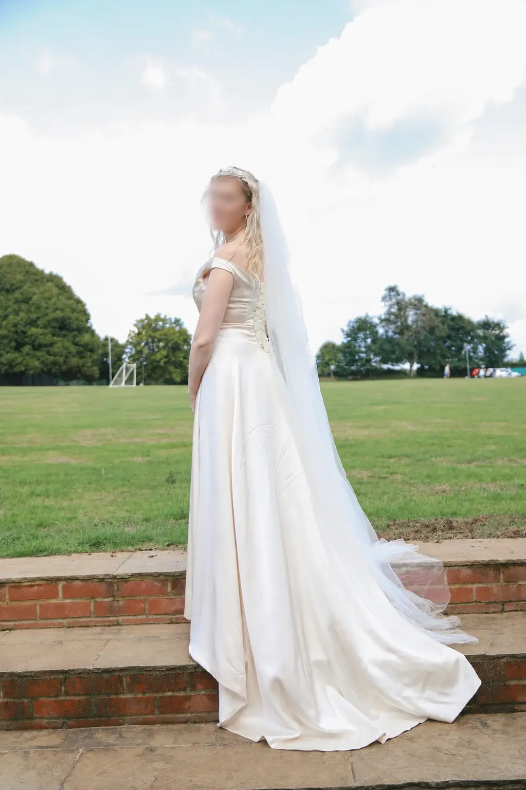 A flowing ivory wedding dress after fitting