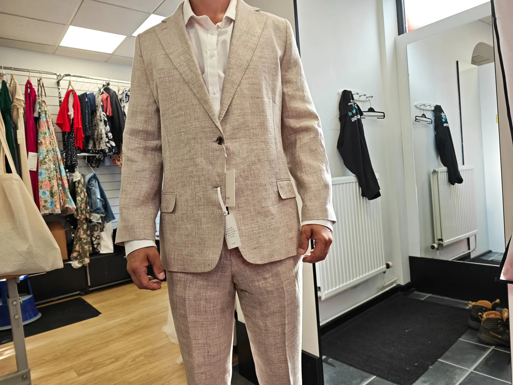 Close detail of a tailored neutral linen suit
