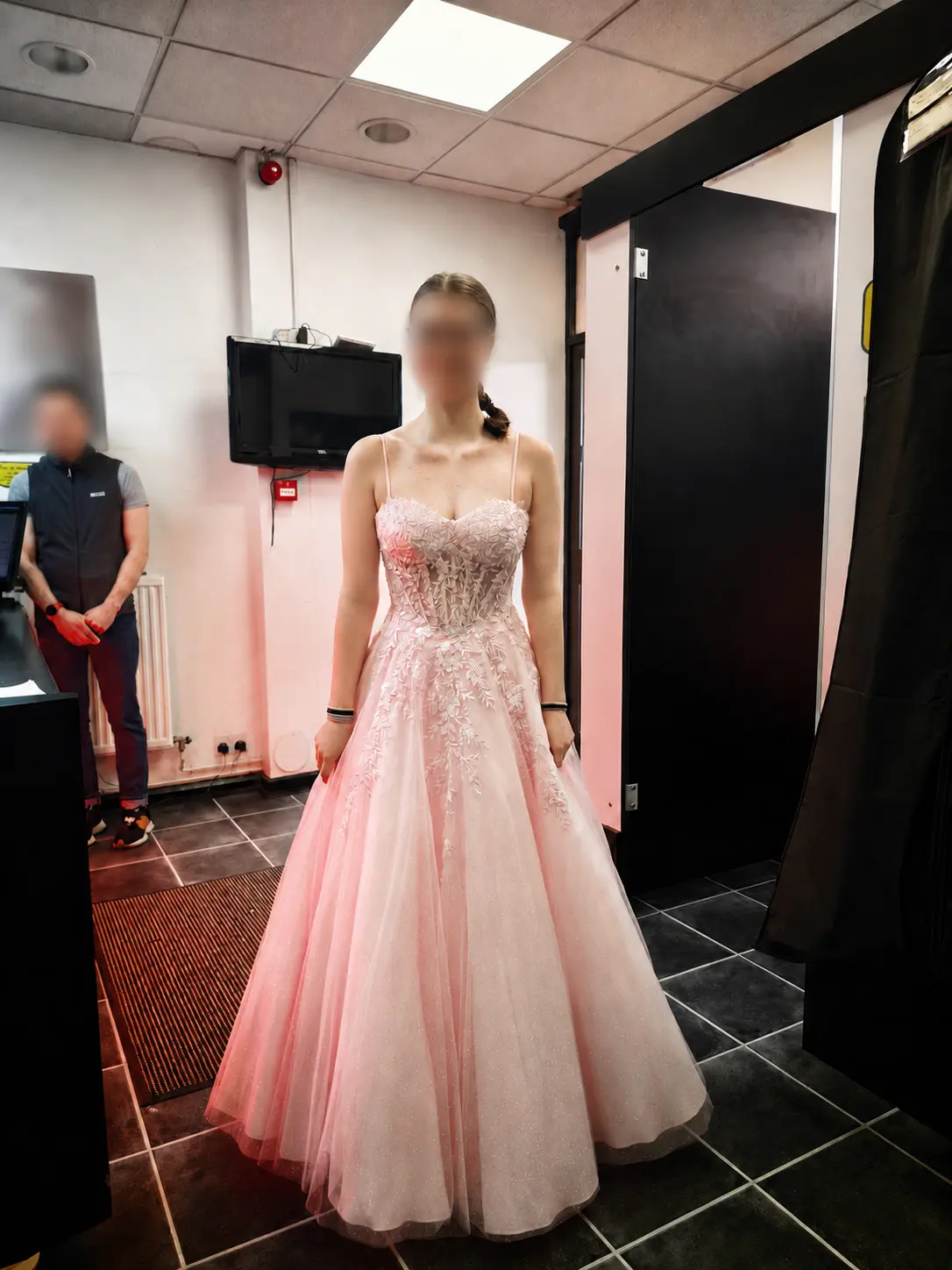 A fitted pale-pink embroidered prom gown