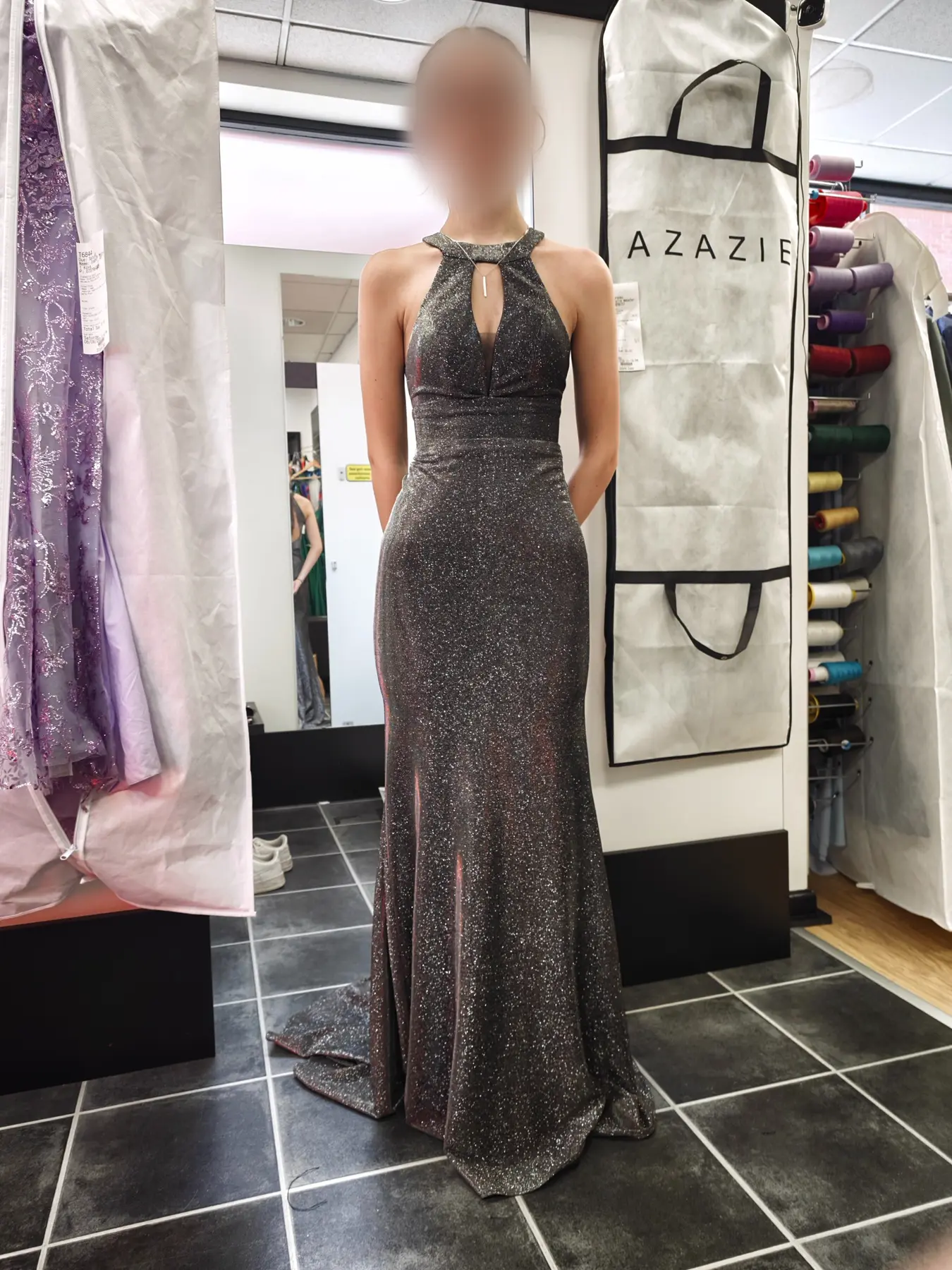 A fitted silver sparkle evening gown